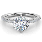 June - Lab grown diamond engagement ring. Centre 1.00 carat round diamond in a 6 claw setting. Pave set diamonds on the band