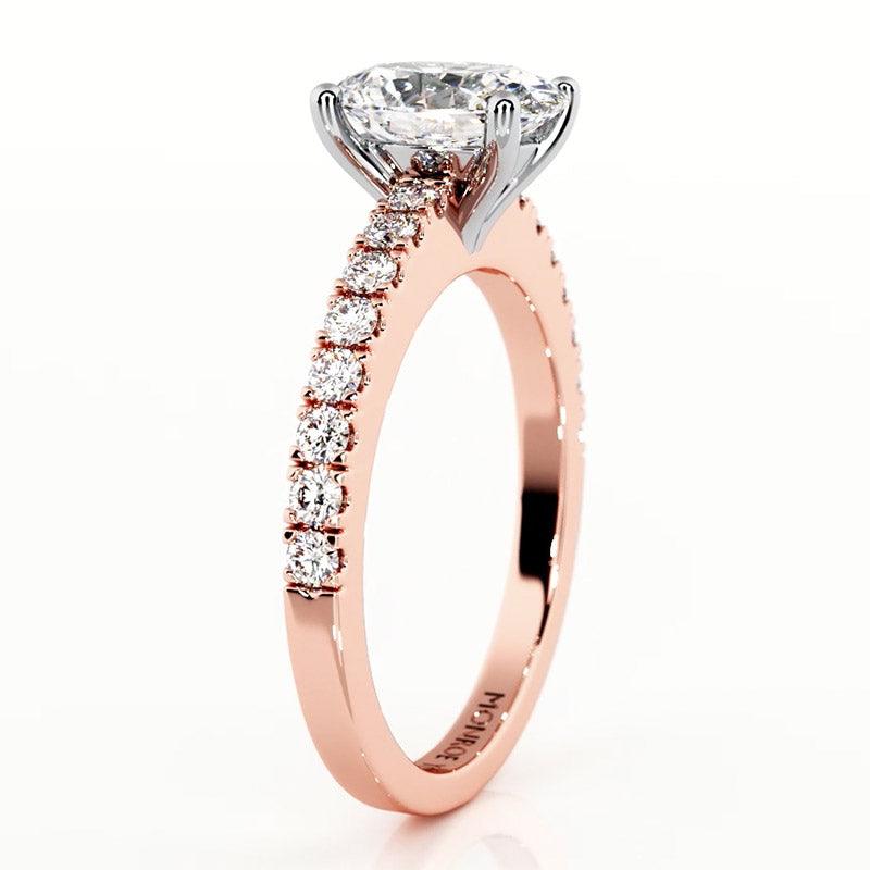 Kendall oval diamond engagement ring in rose gold. Side view showing the beautiful centre setting and diamonds on the band — view 3