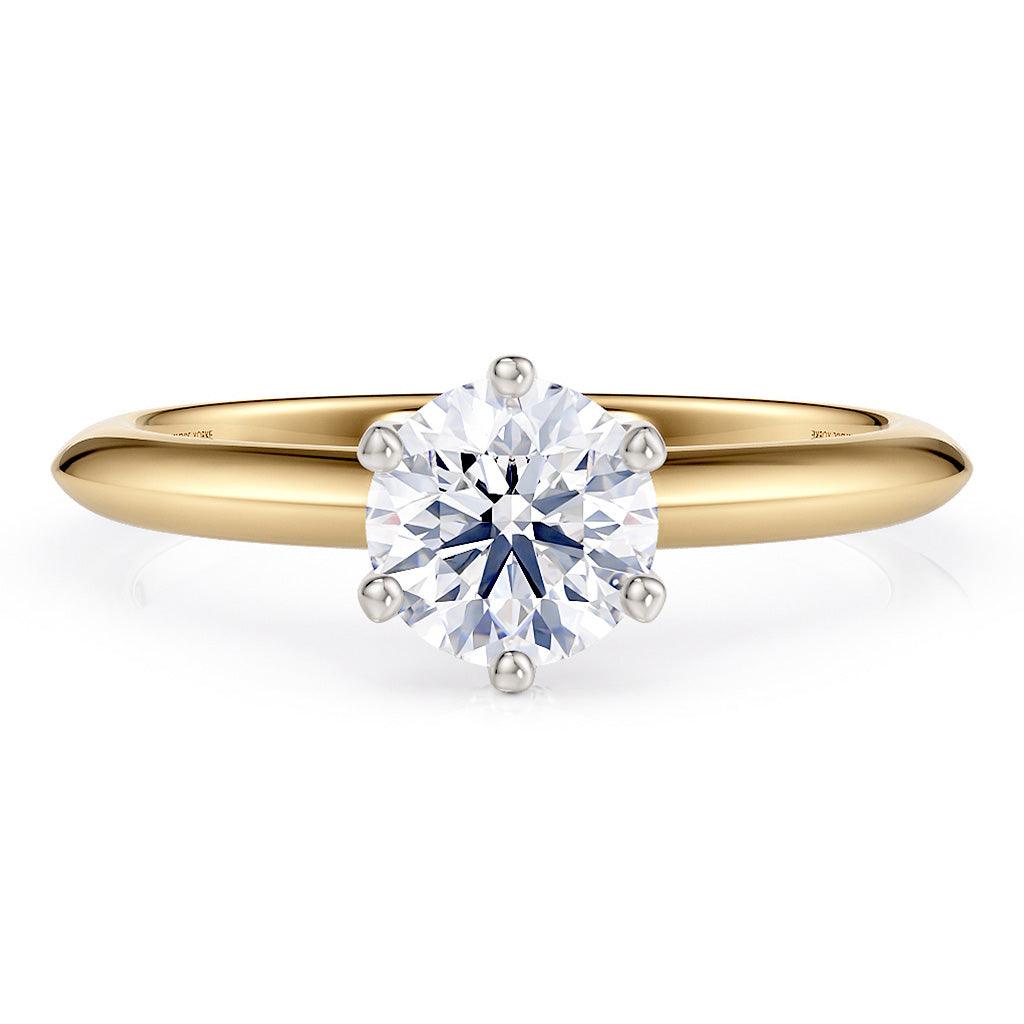 Love - solitaire ring with a lab grown diamond.  Gold band.  Centre diamond in a 6 claw setting.