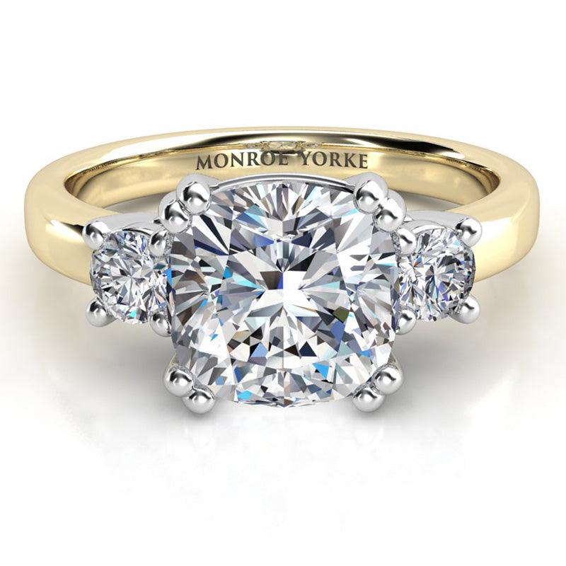 Meghan Markle engagement ring. Three diamond ring with centre GIA certified cushion cut diamond and round diamonds on either side. — view 1