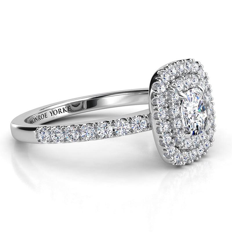 Cushion cut diamond double halo ring in white gold. Side view showing the intricate detail