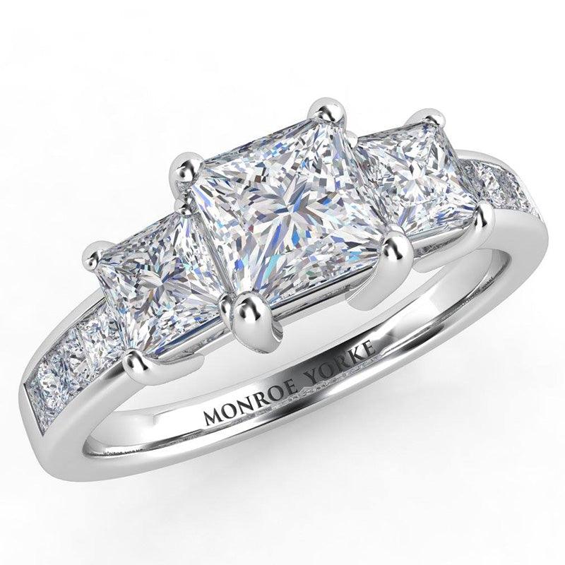 Robina in platinum - Princess cut Three Diamond Ring. Channel set princess cut diamonds on the band — view 2