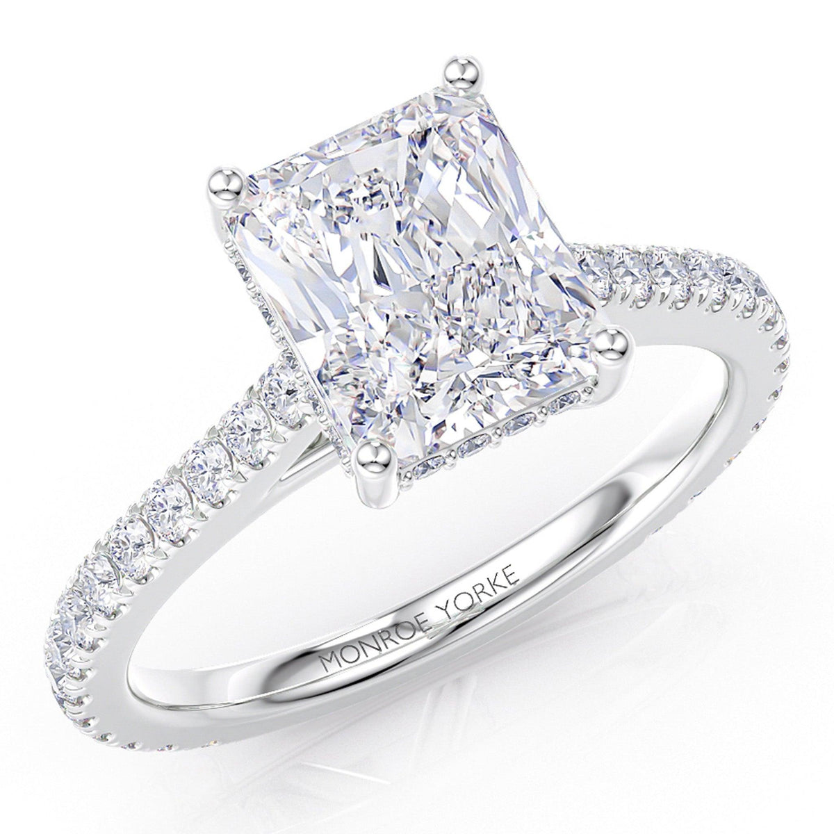 Top view of Seville - Radiant cut diamond engagement ring with a hidden halo of diamonds and diamonds on the band — view 3