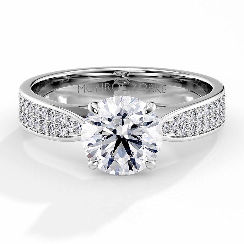 Sophia - Engagement ring, centre round brilliant cut diamond in a 4 claw setting. Pave set diamonds on the band. — view 1