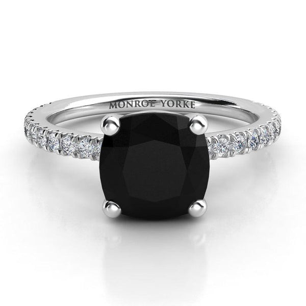 Storm - Platinum, top view. Centre cushion cut black diamond ring with white diamonds on the band.