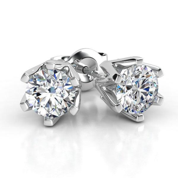 Diamond stud earrings in white gold, six claw setting. Round diamonds. Total 0.20 carats