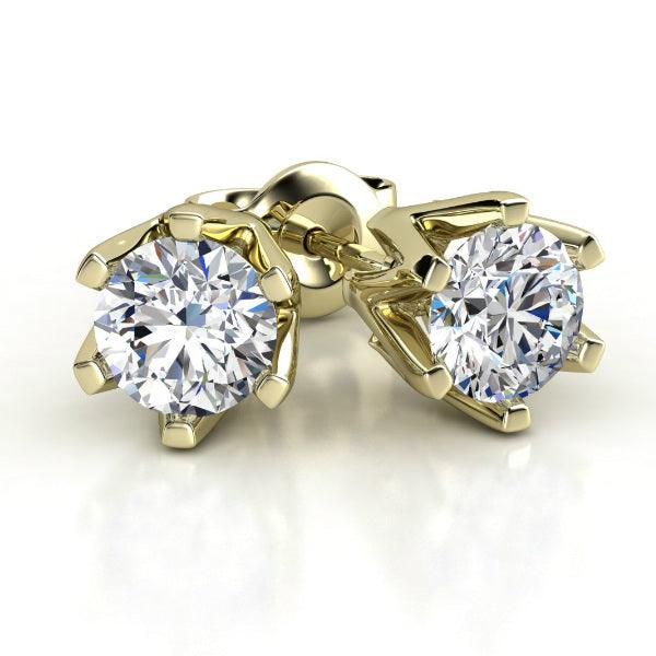 Gold Diamond stud earrings in 18ct yellow gold. Six claw setting with round diamonds. Total 0.20 carats — view 1