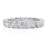 Venus - diamond wedding or eternity ring with diamonds all the way around the band.  White gold or platinum, 1.00 carats. 