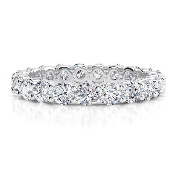 Venus - diamond wedding or eternity ring with diamonds all the way around the band. White gold or platinum, 1.00 carats.