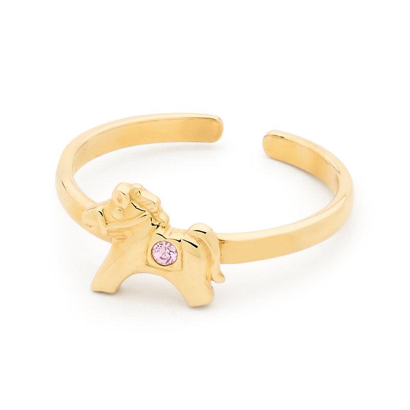 A girls first gold ring with a pony with a pink stone.  Super cute