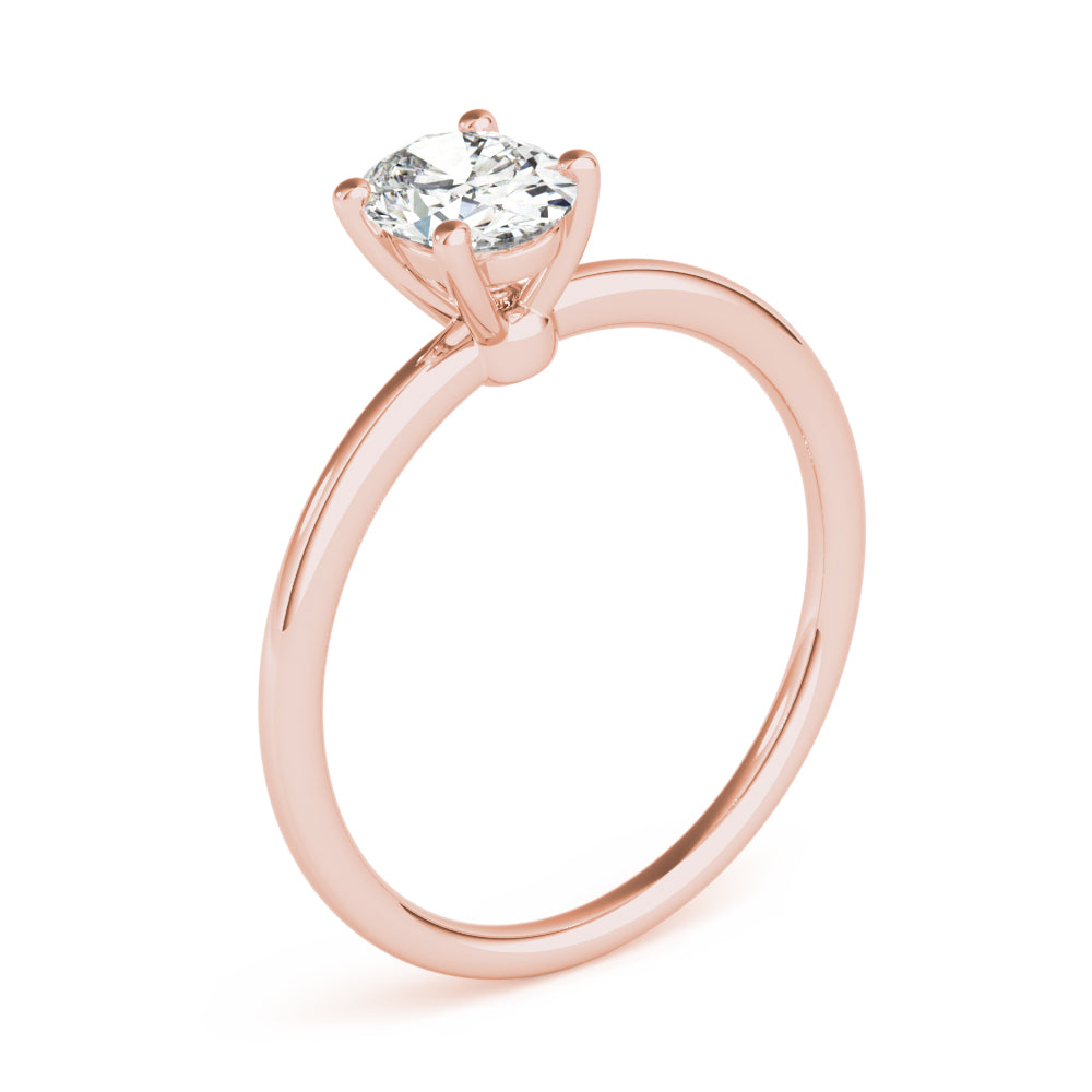Margot oval solitaire engagement ring in rose gold, three quarter view showing the claw head and slim band