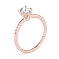 Margot oval solitaire engagement ring in rose gold, three quarter view showing the claw head and slim band
