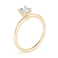 Margot oval solitaire engagement ring in yellow gold, three quarter view showing the claw head and slim band