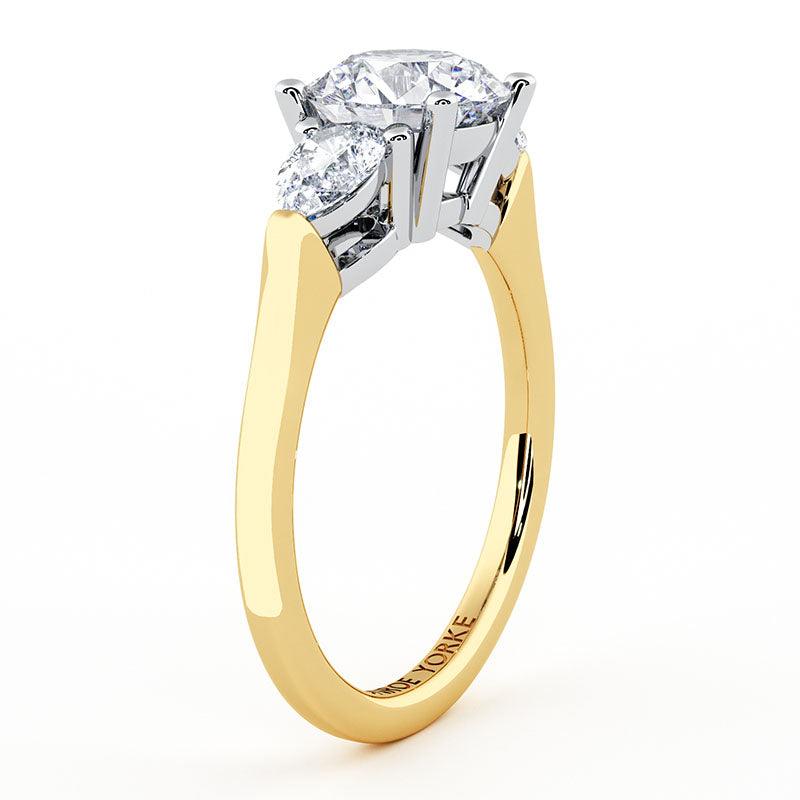 Adele in yellow gold, side view showing the centre setting