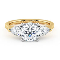 Adele round and pear diamond three stone ring in 18ct yellow gold, top view