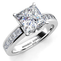 Albany - a princess-cut diamond engagement ring in a polished white gold or platinum band with channel set princess cut accent diamonds.