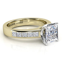 Side view of Albany princess cut diamond ring in yellow gold, showing the beautifully channel set princess cut diamonds on the band. 