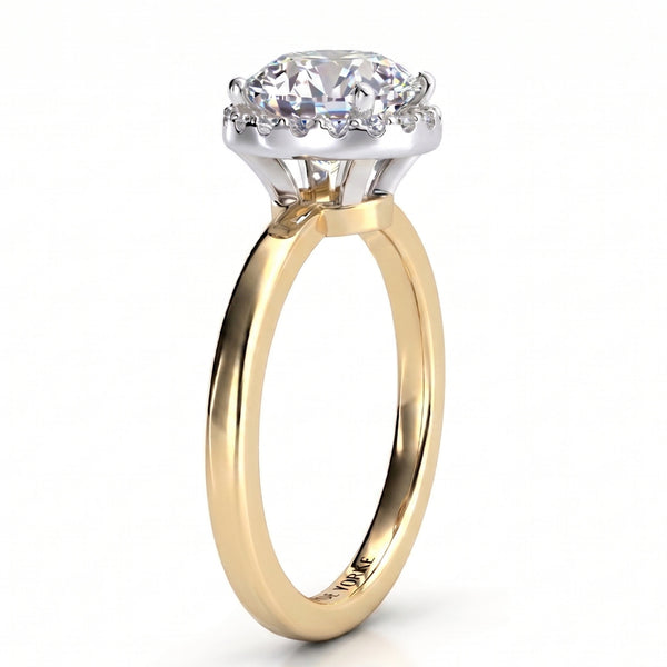 Alexa unique diamond ring in yellow gold, side profile showing half the halo tucked under the centre diamond and the white metal setting head.