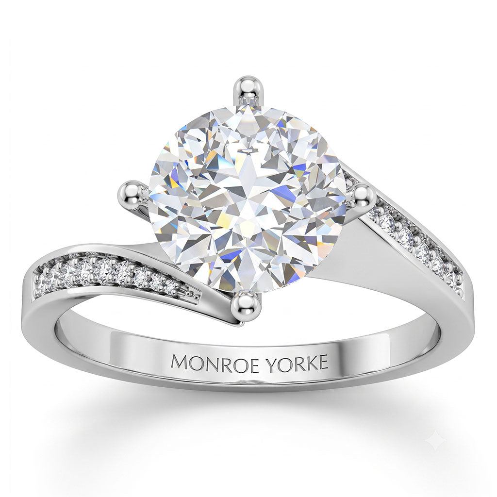 Arbella round brilliant diamond engagement ring in white gold, angled view of the swinging pave band