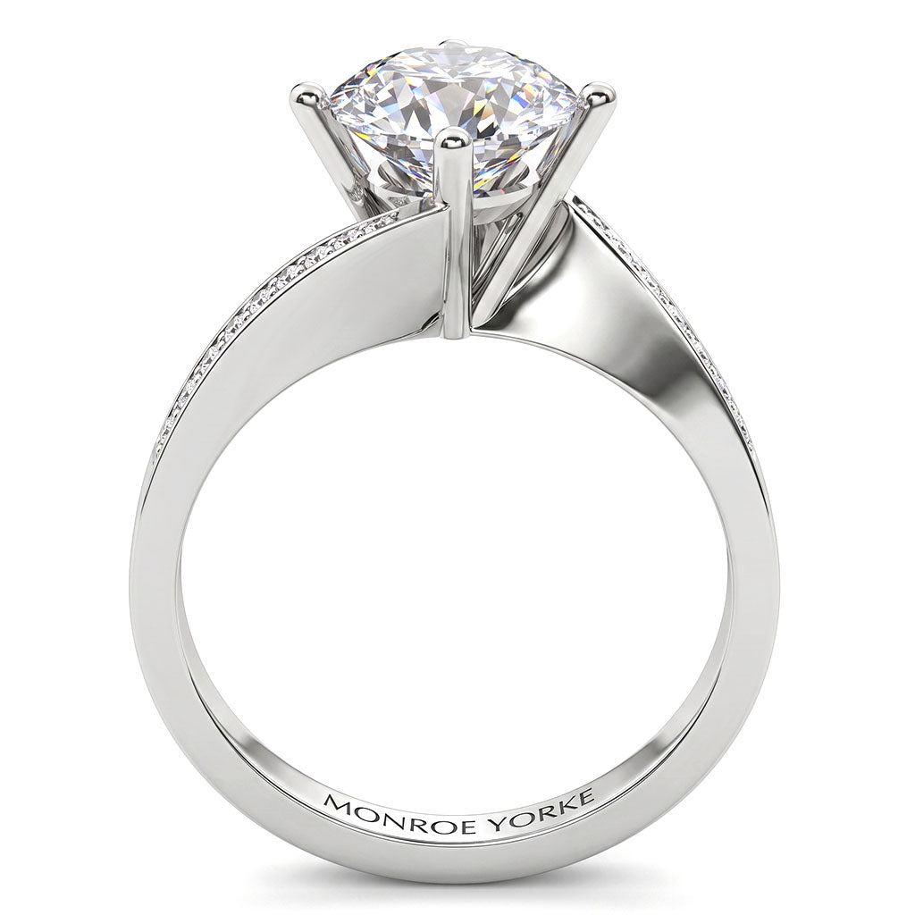 Arbella in white gold, side view showing the pave diamonds sweeping along the band