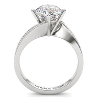 Arbella in white gold, side view showing the pave diamonds sweeping along the band