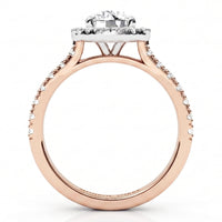 A rose gold engagement ring with a round-cut centre stone and a halo of small clear stones, shown on a clean white background.