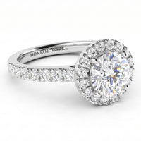 Ariana Halo diamond engagement ring -  round-cut halo engagement ring with a brilliant centre stone and a surrounding halo, set on a pavé-set shank. white gold or platinum. 