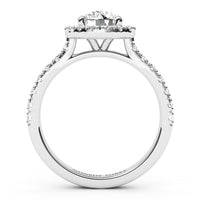 White gold or platinum diamond engagement ring with a round-cut centre stone and a halo of smaller diamonds, shown from the side on a white background.