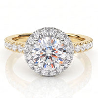Ariana yellow gold halo engagement ring with a round brilliant centre diamond, a halo of smaller round diamonds and a pave set band