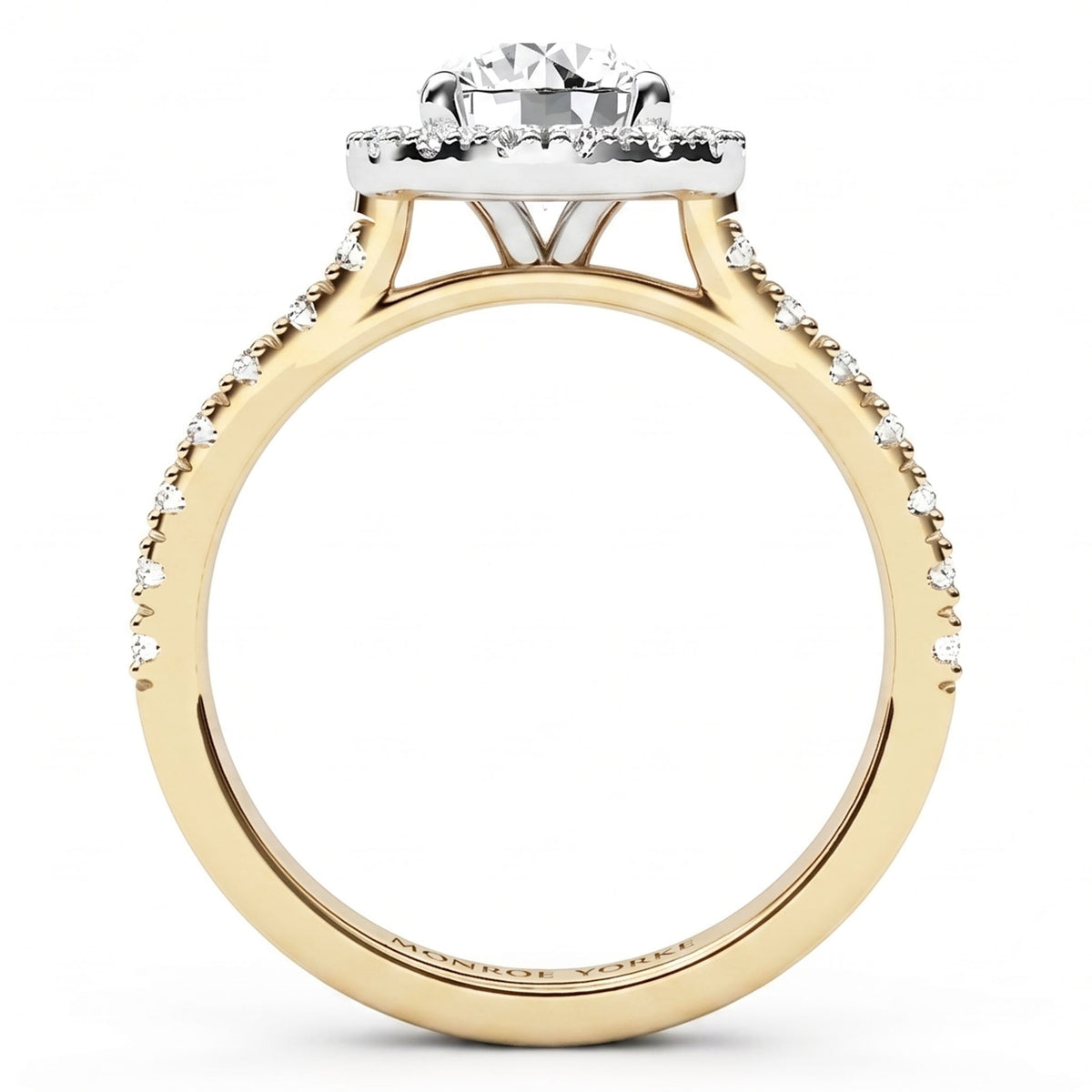 Side view of Ariana - A yellow gold engagement ring with a round-cut centre stone and a halo of small pavé-set diamonds.
