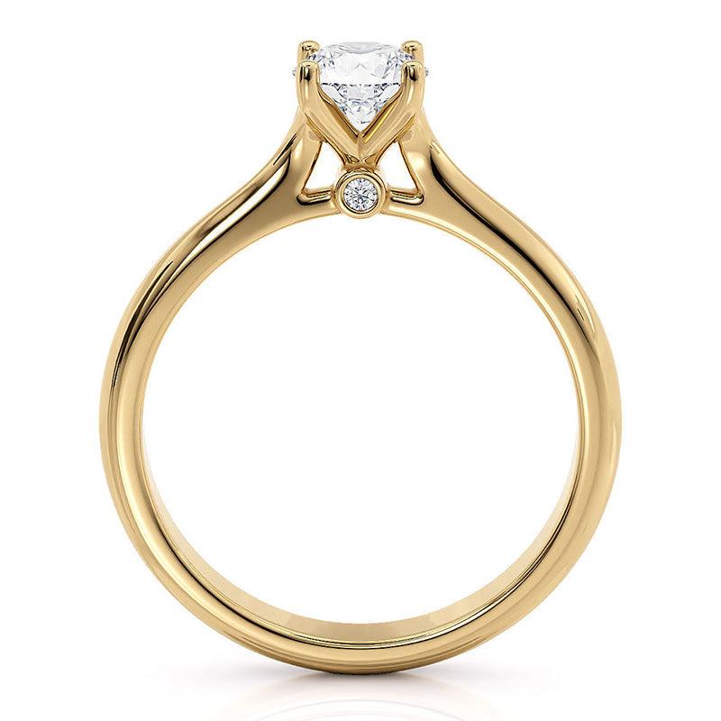 Asti yellow gold solitaire engagement ring, angled view of the four claw head and polished band