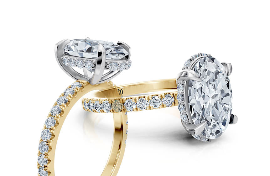 showing an engagement ring with a hidden halo of diamonds under the centre diamond. 