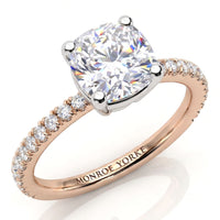 Blake - Rose gold diamond ring with a cushion-cut center stone and pavé-set diamonds on the band,, on a white background.