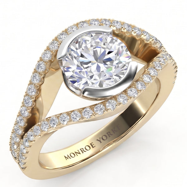 Capri yellow gold halo engagement ring, angled view of the round brilliant centre diamond cradled between two diamond set bands that curve around it, Monroe Yorke engraved inside the band.