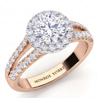 Ceduna - Rose gold halo engagement ring with a round-cut centre stone and small pavé-set accent stones along the split shank, shown on a white background. The inside of the band is engraved with the brand name 'MONROE YORKE'.