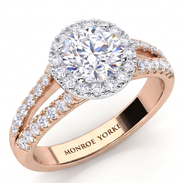 Ceduna - Rose gold halo engagement ring with a round-cut centre stone and small pavé-set accent stones along the split shank, shown on a white background. The inside of the band is engraved with the brand name 'MONROE YORKE'.