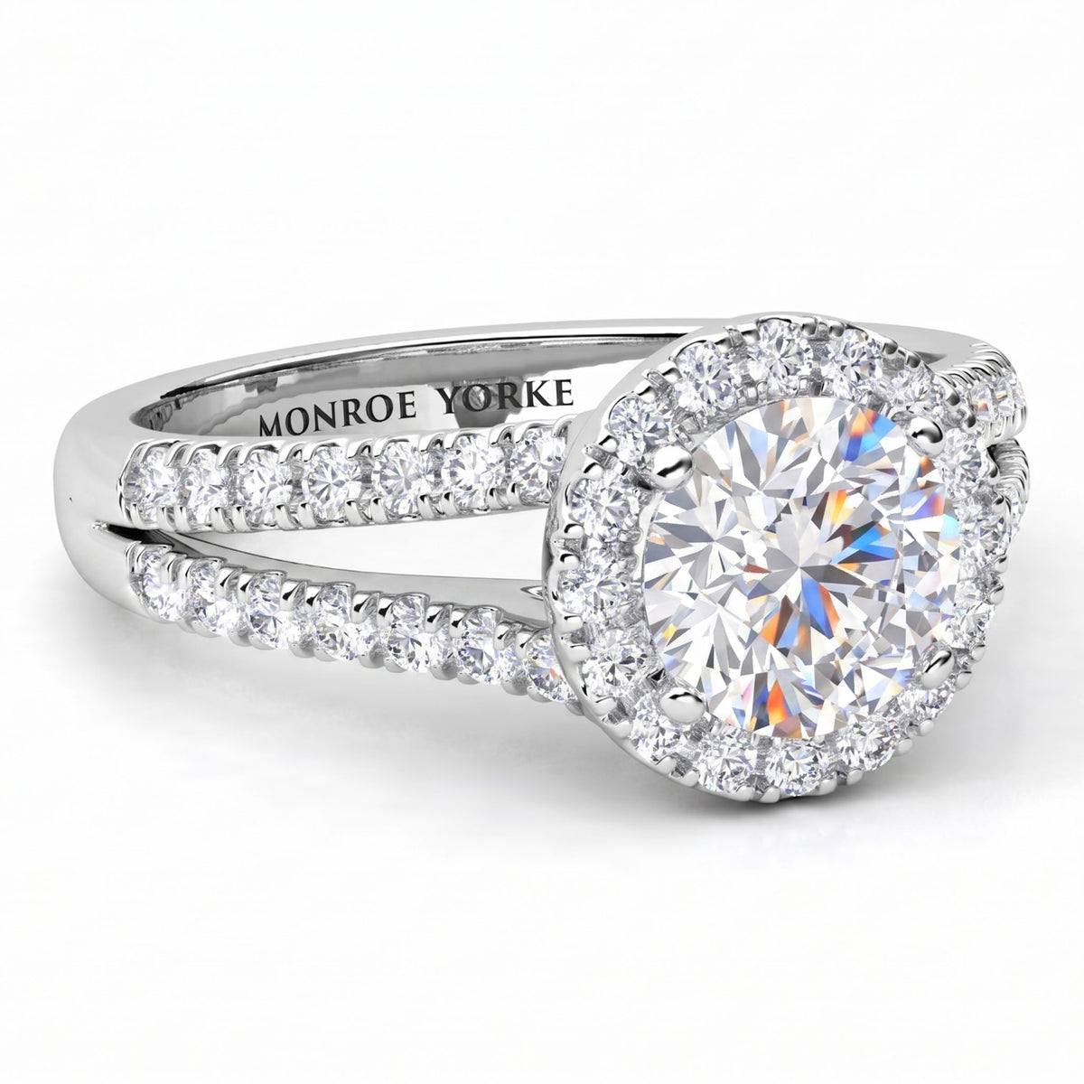 Ceduna - Side view showing split band and centre diamond surrounded by a halo of diamonds. White Gold or Platinum