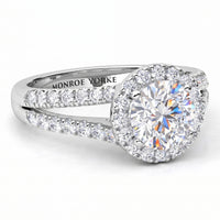 Ceduna - Side view showing split band and centre diamond surrounded by a halo of diamonds. White Gold or Platinum