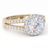 Ceduna - A yellow gold halo ring with a round brilliant-cut centre stone and pavé-set diamonds along the split shank. The inside of the band is engraved with 'MONROE YORKE'.