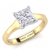 Chester - A princess-cut diamond engagement ring with a yellow gold band engraved with the name 'MONROE YORKE', shown on a clean white background.