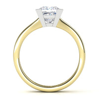 A yellow gold ring with a princess cut diamond set in a white metal prong, shown on a clean white background.