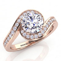 Clementine rose gold engagement ring, round centre diamond with the micro claw set band wrapping around it.