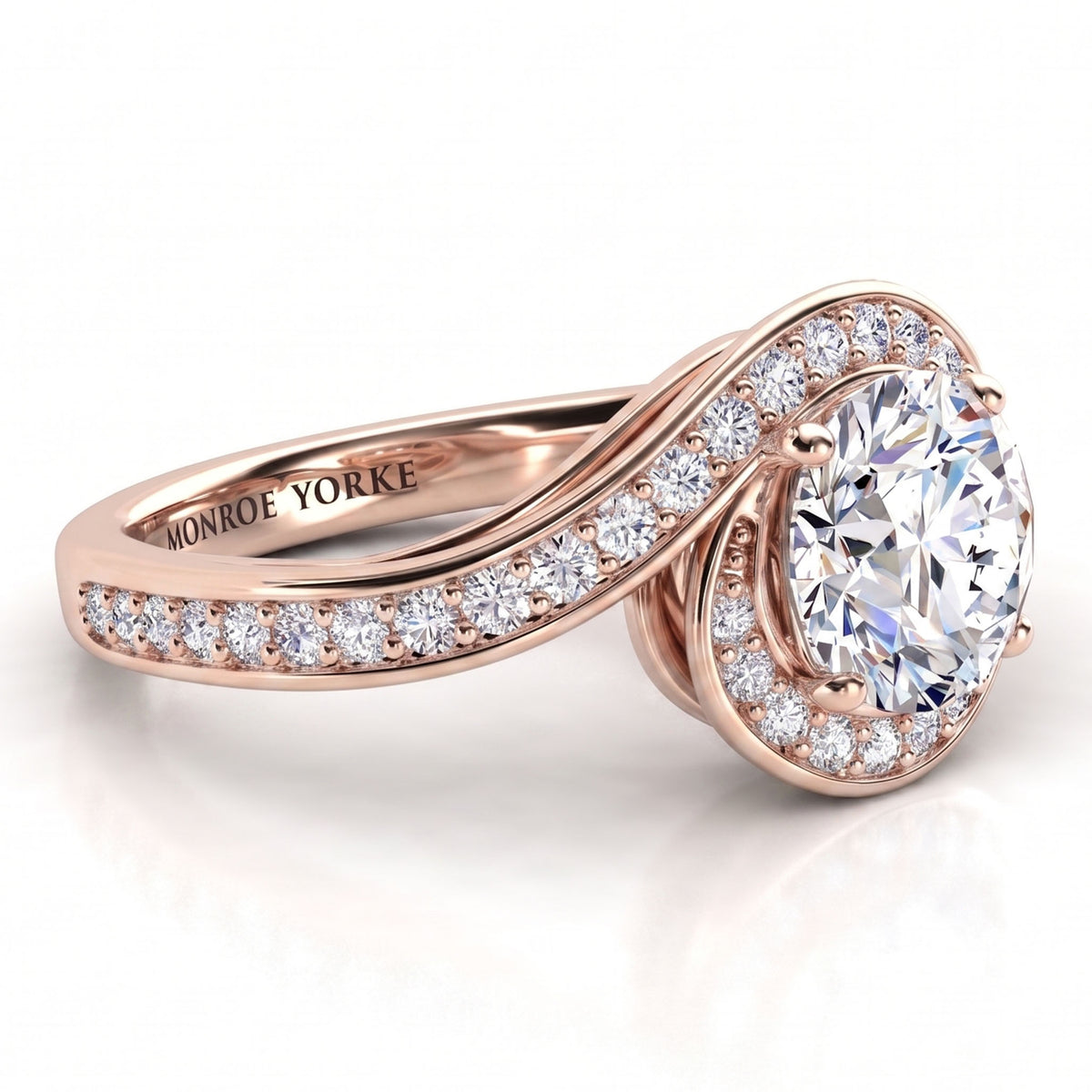 Clementine rose gold engagement ring, side view of the round centre diamond and the wrapped diamond set band.