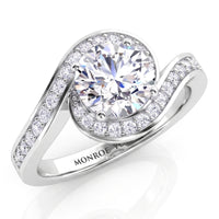 Clementine unique halo engagement ring in white gold or platinum, round centre diamond wrapped by the diamond set band.