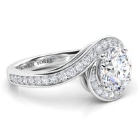 Clementine unique halo engagement ring in white gold or platinum, side view showing the band wrapping the centre diamond.