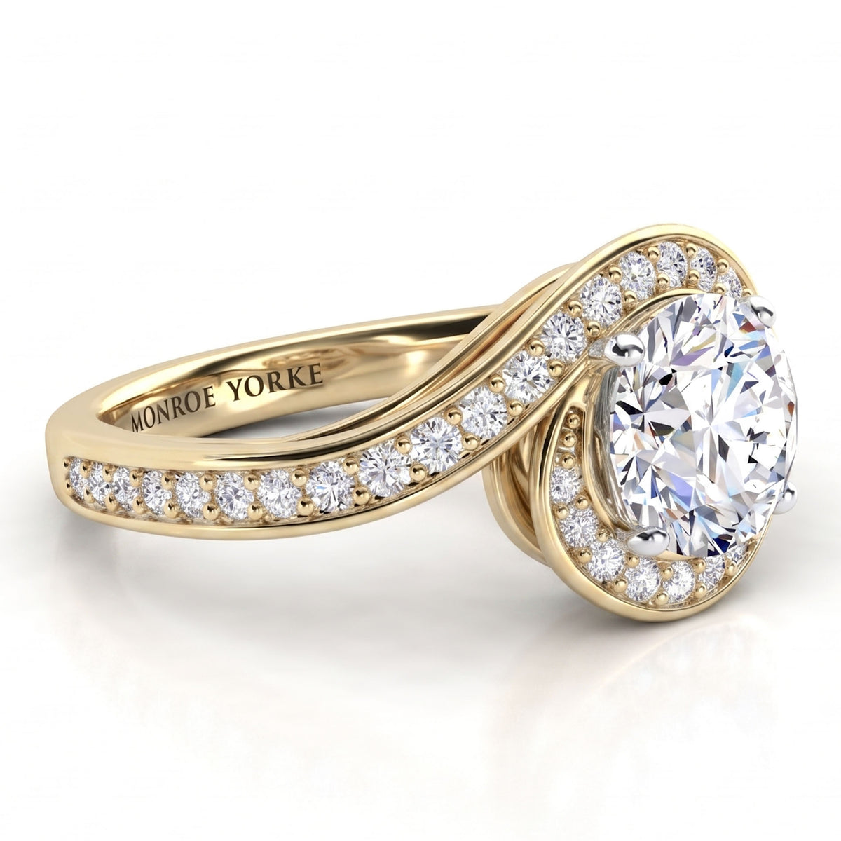 Clementine yellow gold engagement ring, top view of the round brilliant centre diamond and the micro claw set wrap.