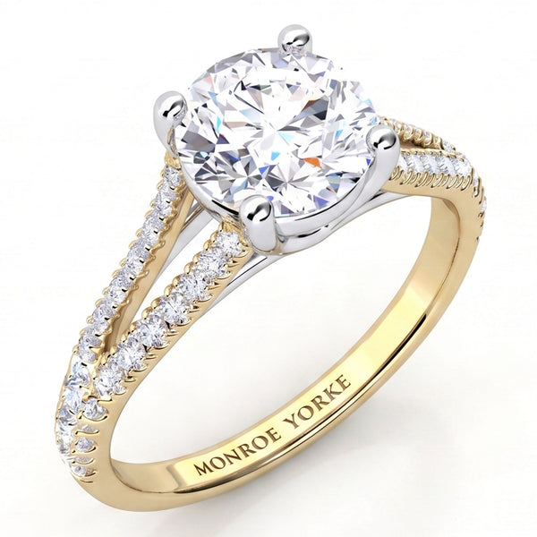Cora yellow gold split band engagement ring, round centre diamond in a crossover four claw setting.