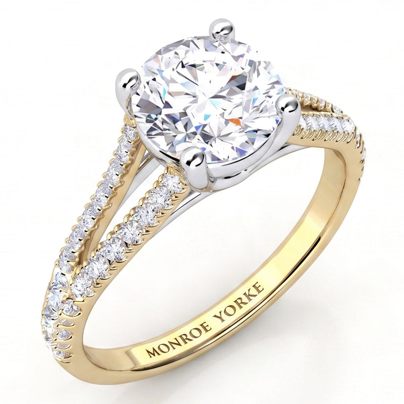 Cora yellow gold split band engagement ring, round centre diamond in a crossover four claw setting.
