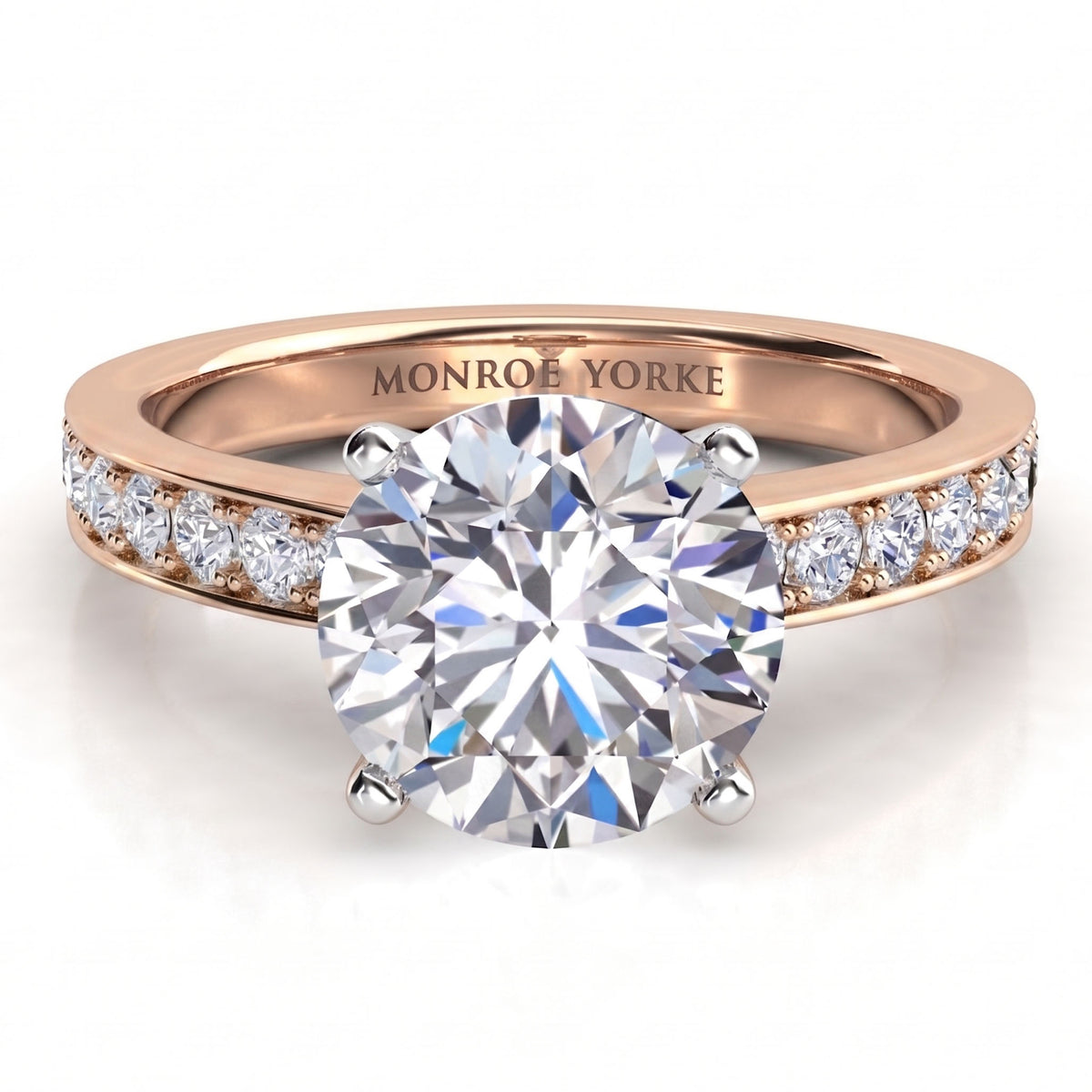 Danae engagement ring in rose gold, pave diamonds set either side of the centre stone, MONROE YORKE engraved inside the band.