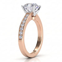 Danae engagement ring in rose gold. Side view of the four claw setting and pave-set shoulders.